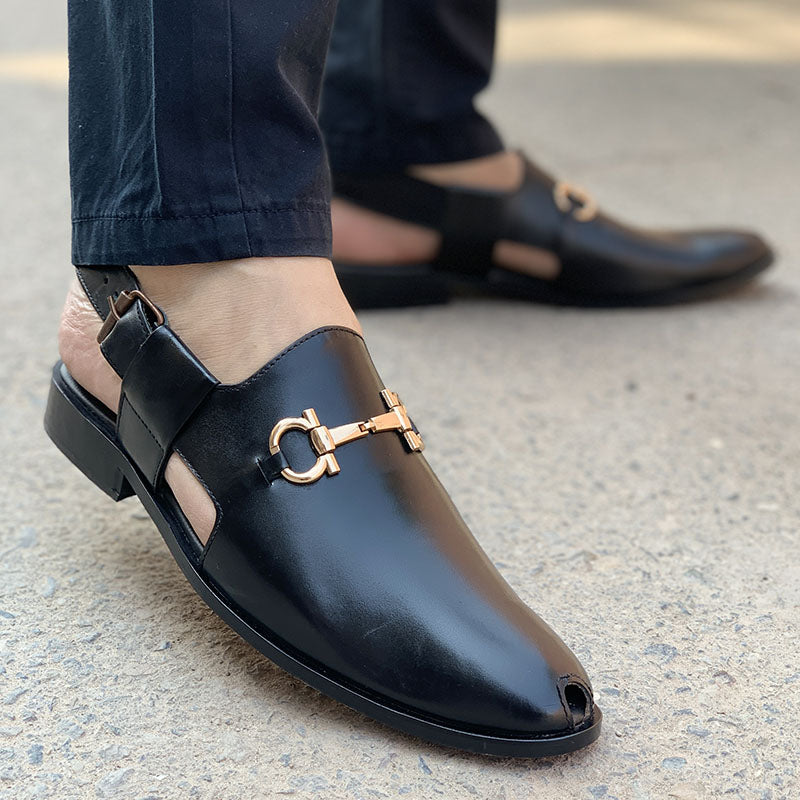 Men's black leather mules with gold-tone horsebit detail and adjustable ankle strap