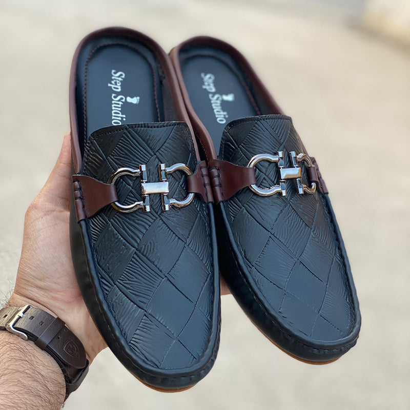 Handmade black leather mules for men with woven texture and silver horsebit detail