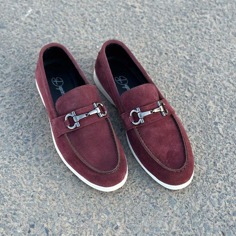 maroon loafers with silver buckles