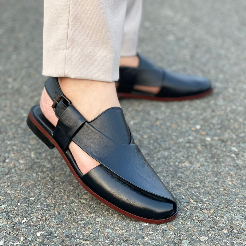 A black pure leather Kheri with a lace-up closure and a rubber sole