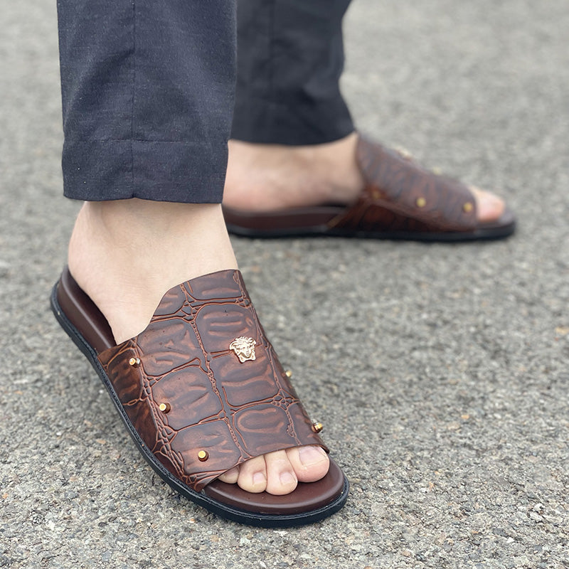 Men's brown crocodile texture leather slides with gold studs and emblem